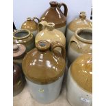 A collection of eleven various stoneware jars and flagons including one by Powell of Bristol,