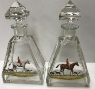 A pair of early to mid 20th Century cut glass faceted conical shaped decanters and stoppers,