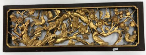 A collection of carved giltwood items to include a pair of Chinese open work panels decorated with
