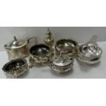 A collection of silver wares to include a pair of Victorian cauldron salts raised on lion's paw