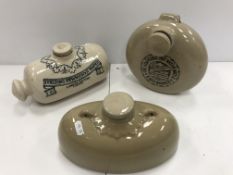 A collection of four stoneware foot warmers including two "Doulton's Improved" foot warmers,