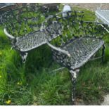 A pair of black painted (previously white) cast iron garden two seat bench seats,