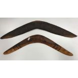 A vintage Australian native wooden boomerang carved with various bird figures and trees, 62 cm long,