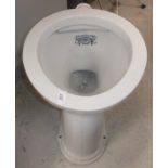 A circa 1900 porcelain toilet bowl inscribed "Waterfall Closet Registration No.