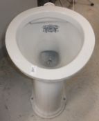 A circa 1900 porcelain toilet bowl inscribed "Waterfall Closet Registration No.