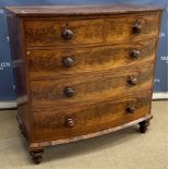 A Victorian figured mahogany bow fronted chest of two short over three long graduated drawers with