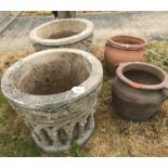 Two Haddonstone garden urns with column style decoration,