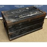 A vintage iron bound wooden travel trunk inscribed "Roger Bingley Travellers Club" with tin lined