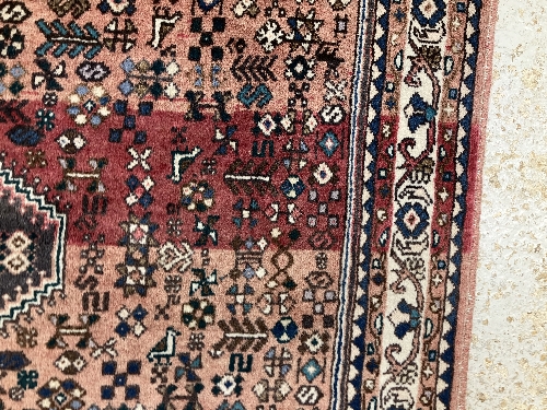 A Persian rug, the central panel set with all-over floral motifs on a dark blue ground, - Image 32 of 66