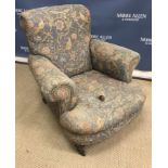 A late Victorian upholstered scroll armchair on turned and ringed front legs 85 cm wide x 80 cm