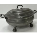 An oval pewter tureen and cover,