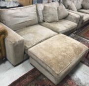 A modern mushroom or taupe upholstered four seat sofa on block supports 245 cm wide x 102 cm deep x