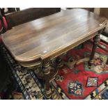 A 20th Century Continental walnut and gilded centre table in the 19th Century French manner,