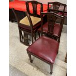 A set of seven Edwardian mahogany pierced slat back dining chairs with upholstered seats on square