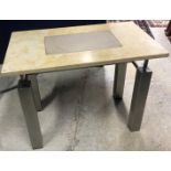 A Sienna marble topped and polished steel single drawer work table with suede covered glass panel