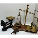 A set of Victorian brass scales and weights on a mahogany base,