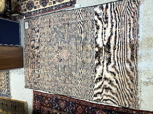 A Persian rug, the central panel set with all-over floral motifs on a dark blue ground, - Image 55 of 66