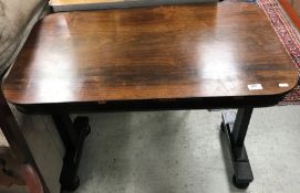 A Victorian rosewood centre table of rounded rectangular form,