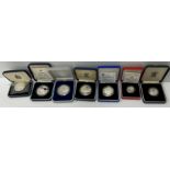 A collection of sixteen various silver proof commemorative coins including 1976 Turks and Caicos