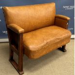 An early 20th Century brown leather upholstered folding two seat cinema or theatre chair on plain
