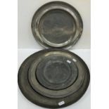 Five 19th Century pewter plates / chargers, one inscribed "E.