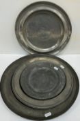 Five 19th Century pewter plates / chargers, one inscribed "E.