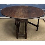 A 19th century oak oval gate-leg drop leaf dining table 119 cm x 135 cm x 75 cm high