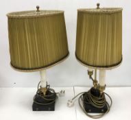 A pair of brass and black painted iron based twin light table lamps in the Victorian style,