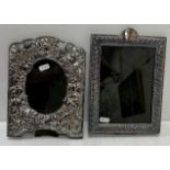 A modern silver photograph frame in the Arts & Crafts manner with embossed squirrel and fruiting