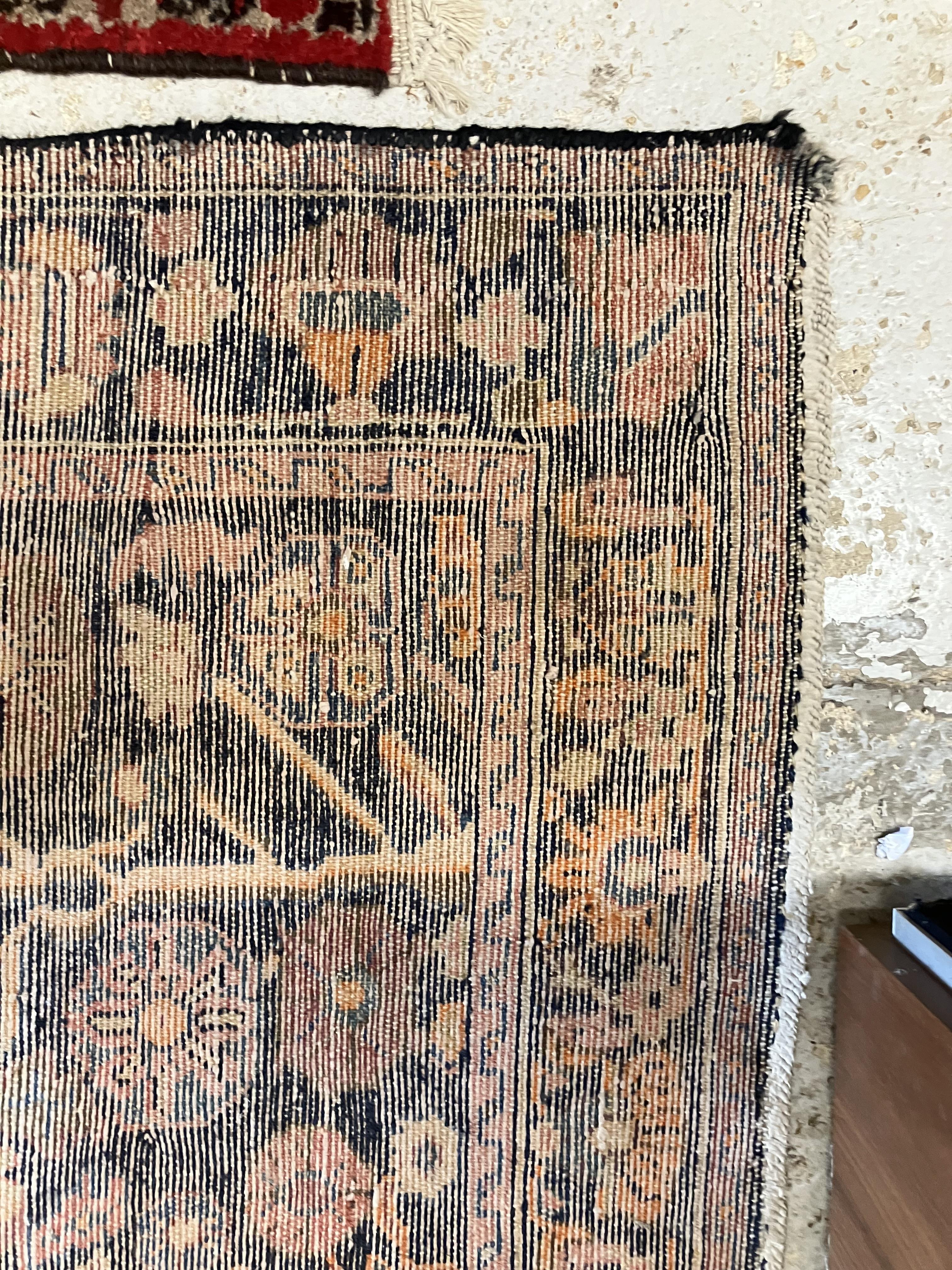A Persian rug, the central panel set with all-over floral motifs on a dark blue ground, - Image 5 of 66