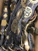 A collection of various martingales with horse brasses, one pair with swingers,