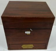 A 19th Century mahogany apothecary's chest containing eleven various bottles, small measuring flask,