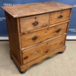 A late Victorian stained pine chest of two short over two long drawers on a bracket foot base and