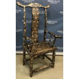 A Chinese ebonised pen work decorated scrolling floral and foliate design yoke back arm chair of