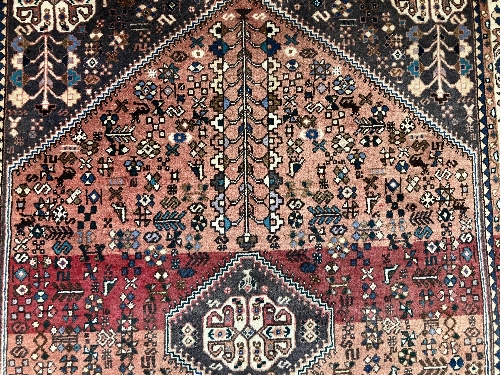 A Persian rug, the central panel set with all-over floral motifs on a dark blue ground, - Image 47 of 66