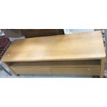 A modern Ercol light oak dwarf side cabinet,