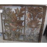 A 19th Century wrought iron gate made up of two painted wrought iron religious sections,