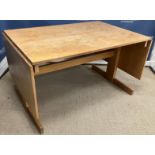 A modern oak drop leaf rectangular dining table on end trestle supports 220 cm long x 85 cm wide x