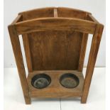 An Arts & Crafts style oak two section umbrella stand 63.5 cm high x 44.5 cm wide x 22.