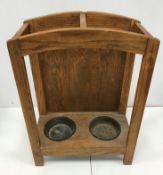 An Arts & Crafts style oak two section umbrella stand 63.5 cm high x 44.5 cm wide x 22.