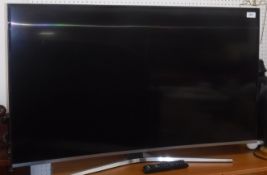 A Samsung model UE43KU6670U curved screen HDMI television and remote control,