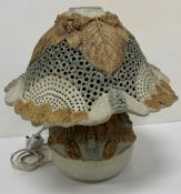 A Studio Pottery glazed flower head or fungus table lamp with foliate and insect decoration bearing