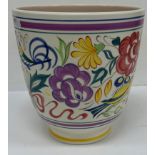 A Poole Pottery vase with bird amongst flowers decoration raised on a circular foot 18 cm diameter
