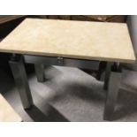 A Sienna marble topped and polished steel single drawer work table with suede covered glass panel