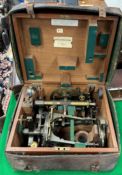 A circa 1900 lacquered brass theodolite in fitted wooden case,