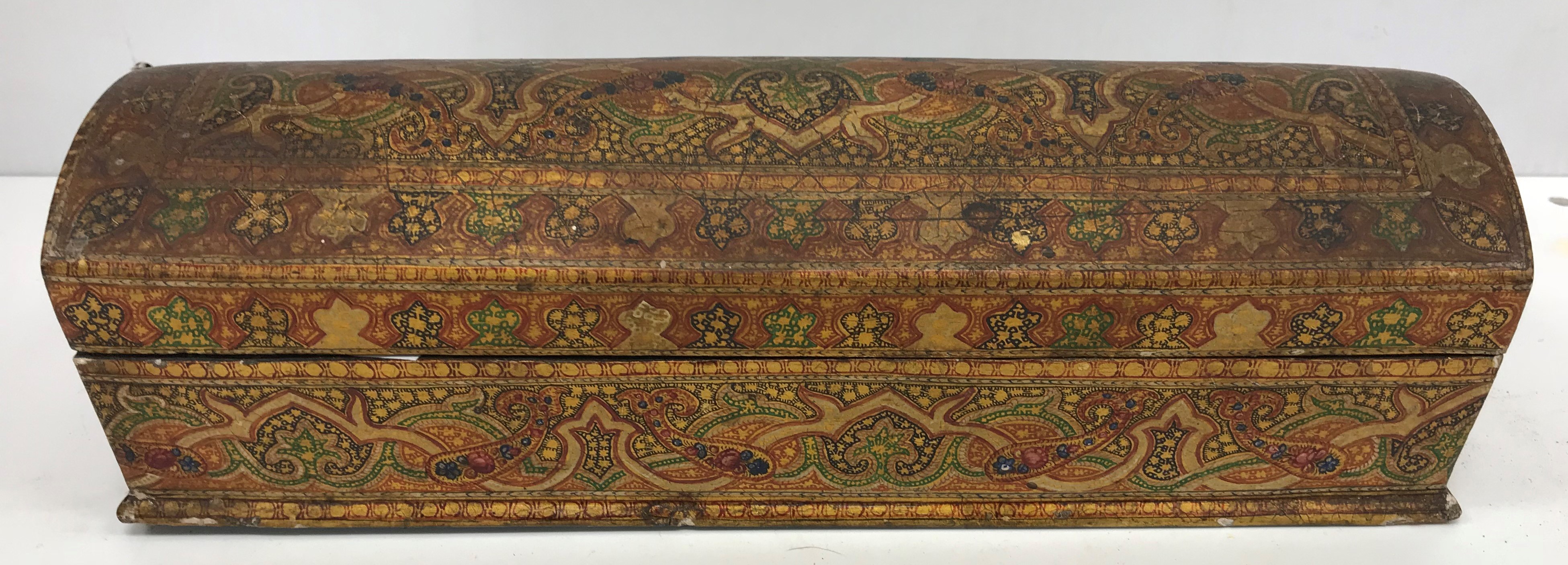 A Persian style lacquered pen box with domed lid 28 cm wide x 9 cm deep x 8.