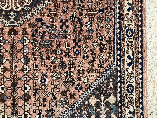 A Persian rug, the central panel set with all-over floral motifs on a dark blue ground, - Image 42 of 66