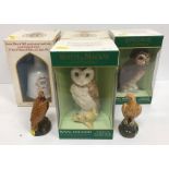 A collection of four Royal Doulton Whisky bottles including "Whyte & Mackay Short Eared Owl" and