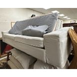 A modern upholstered sofa bed with cream loose covers 238 cm wide x 90 cm deep x 62 cm high