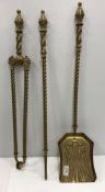 A Victorian barley-twist shafted brass three piece fire iron set,